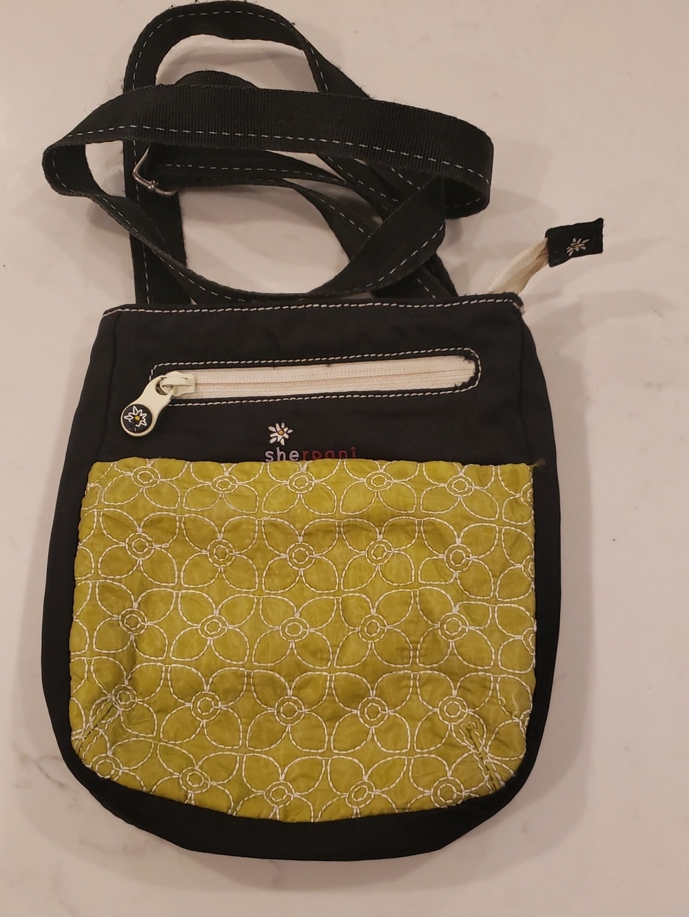 Sherpani Black Crossbody with Olive Quilted Front Pocket